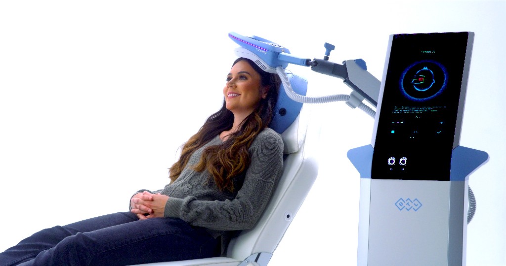 Calm TMS treatment setting with modern equipment